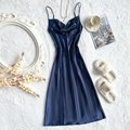 Elegant navy blue satin sleepwear dress with V-neck and side slit on white plush background - Blue