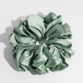 Detailed view of a single green satin silk scrunchie with smooth glossy texture and pleats - Green Large