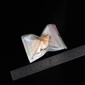 Laser holographic ziplock bag for jewelry 8-10cm shown with a metal measuring ruler - 7x10cm Single-sided 7-strand 20 Pieces/pack