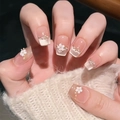 French ombre press-on nails in nude pink with 3D white flowers and pearl accents - Boxed with Tool Kit / Soft Flower Whispers