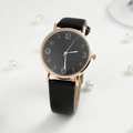 Minimalist women's quartz watch with black dial and rose gold case on pearl background - Black