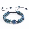 Macro shot of double-layered blue tiger eye stone bracelet with black woven adjustable cord - Sky Blue Tiger Eye Bracelet