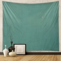 Detail of minimalist teal bohemian tapestry on white wall in a modern living room - CX0327-15