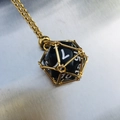 Unique gold mesh cage necklace pendant featuring a black 20-sided dice on a fine chain - Gold Cage with Black Dice