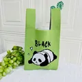 Grass green knitted tote bag featuring a cute panda pattern and BLACK typography - Letter Panda Green