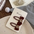 Brown polka dot bow hair clips with embroidered flowers on a display card for girls - Yarn Bow Flower Hair Clip