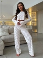 Close-up of heart print lounge set featuring red lettuce edge trim on sleeves and hem - S / Red Heart