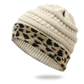 Close-up of beige knit beanie with leopard print cuff and warm fleece lining - One Size / Beige