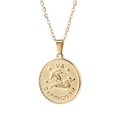 Macro shot of gold Capricorn zodiac disk pendant showing embossed details and chain - Capricorn