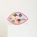 Pink ceramic tray with evil eye, star and moon patterns on a white display pedestal - Pink Cloud Style