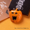 Detailed close-up of a 2.5x2.7cm glossy orange resin pumpkin charm for Halloween DIY crafts - Screaming Pumpkin