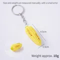 Miniature roasted corn keychain charm in yellow resin with realistic grilled details - Roasted Corn (Keychain)
