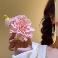 Elegant silver tassel earrings with blue accents shown on model with floral decor - Tassel Decor / Pink