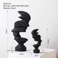 Set of two black abstract face sculptures in resin for modern home decor displays - Artistic Portrait Textured Black Set - Combination B