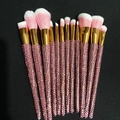 Detail of 12-piece makeup brush set with pink rhinestones and gold ferrules on black - 12pcs Set / Pink