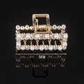 Detail showing a 5cm golden geometric hair claw with pearls and rhinestones on black - Half Rhinestone Half Pearl Square 5CM Claw Clip