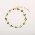 Detailed close-up of golden daisy bracelet with green petals and adjustable lobster clasp - Green Daisy
