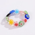 Detail of bohemian millefiori glass flower beaded ring with colorful floral patterns - Colorful Millefiori Glass