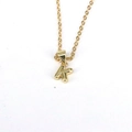 Minimalist gold necklace with a polished 26-letter K pendant on a pure white background - Letter K