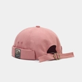 Close-up of pink canvas docker cap featuring vintage label and adjustable buckle strap - Adjustable / Standing Bear Dusty Pink