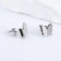 Minimalist silver butterfly stud earrings with matte and polished wings on a stone base - Steel
