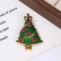 Macro shot of green enamel Christmas tree brooch with red floral patterns and rhinestones - Style 1 (5.7*4.2cm)