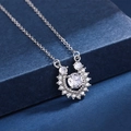 Macro detail of horseshoe pendant with central round zircon and pavé diamonds - Xl-59