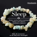 Macro detail of handmade natural irregular multi-color gemstones bracelet on black surface - Amazonite