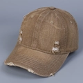 Detail view of distressed brown washed denim baseball cap with vintage frayed hole accents - M (56-58cm) / Camel