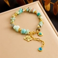 Bracciale cinese con pietre naturali, cuore di turchese e ciondolo occhio di Allah - Stile Occhio di Horus Cuore (B1464)