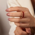 Elegant gold eternity ring with rectangular red zircons worn on finger for a chic look - Style A Deep Red
