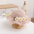 Close-up of pink straw sun hat for girls with white daisies and wavy scalloped brim edges - Single Hat / Pink
