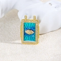 Detail of gold rectangular pendant with blue enamel eye and white gemstone border - Blue Eye Style (ZYN-DMK876G-2)