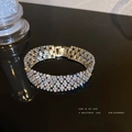 Silver wide cuff bracelet with multiple rows of sparkling cubic zirconia and metal clasp - Silver Bracelet