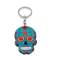 Detail of blue sugar skull keychain with pink floral patterns and metal ring - Style E