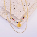 Detailed close-up of double-layer beaded necklace with rose embossed round pendant - Rose