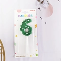 Green dinosaur number 6 birthday candle with white dots in blister pack packaging - Number 6