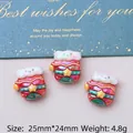Three pieces of pearlescent resin glove-shaped DIY charms with stars and smiley patterns - Gloves
