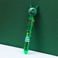 Detail of Christmas multi-color pen with elk antlers and glittery shaker top ball - Green Christmas Tree
