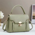 Litchi pattern light green handbag with gold twist lock and adjustable shoulder strap - Green