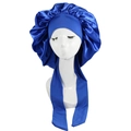 Close-up of a large navy blue satin sleep cap with adjustable long ribbon straps - Blue