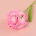 Close-up of handmade crochet carnation with white petals and pink edges on pink background - Finished Carnation Stems (gradient Glitter)