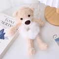 Close-up of cute beige and white plush teddy bear hair tie on a minimalist background - White