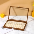 Walnut finish wooden jewelry box with glass lid displaying multiple gold necklaces - Necklace & Bracelet / Walnut With Beige Interior