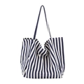 Minimalist canvas tote bag featuring classic blue and white horizontal stripes - Thin Blue Stripe