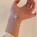 Silver butterfly necklace featuring white cat eye stone wings and beaded chain detail - X1528 Silver - Cat Eye Butterfly