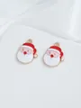 Detailed close-up of two Santa Claus enamel charms on white satin fabric - Cartoon Santa Head (9)