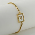 Golden stainless steel chain bracelet with shell inlay and letter V pendant detail - Letter V