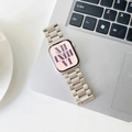 Close-up of three-bead stainless steel watch band on a laptop keyboard in a workspace - 38/40/41mm / Starlight