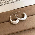 Detail view of silver crescent hoop earrings with brushed matte finish on a brown tray - 16# Silver Matte Brushed Crescent Ear Hook